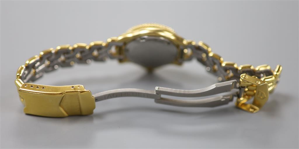 A ladys modern gilt steel Tag Heuer Professional quartz wrist watch, cased diameter 23mm, ex.crown.